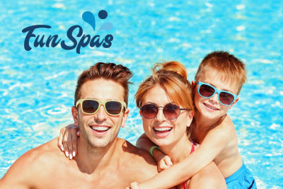 family posing in the pool